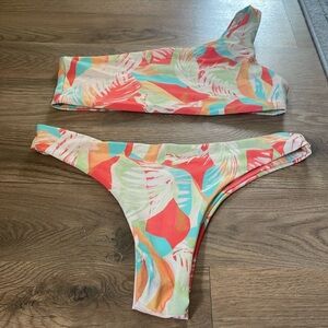 Skatie bathing suit. Matching one strap top and skimpy bottom. Barely worn